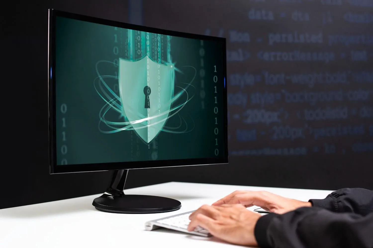 Person reviewing device security on a laptop